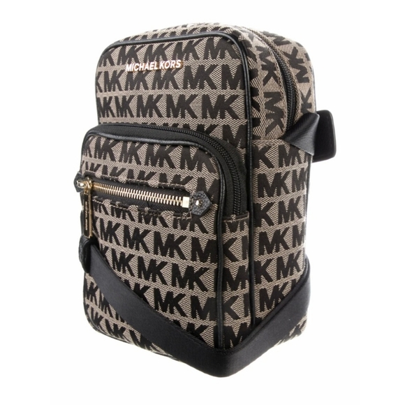 Michael Kors Handbags - 🎉HP🎉 Michael Kors Monogram Flight Canvas Crossbody